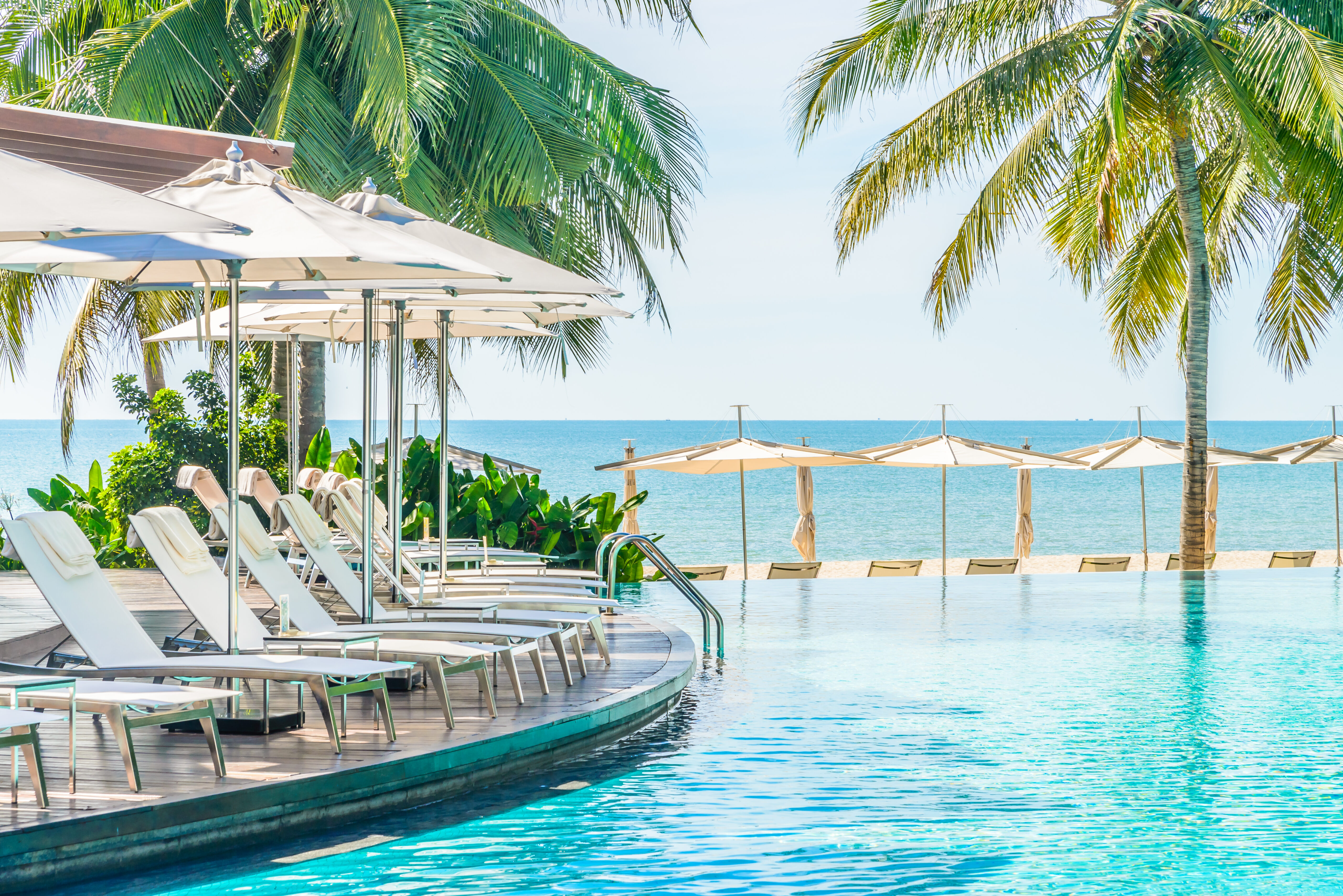 Umbrella with chair in hotel  swimming pool resort